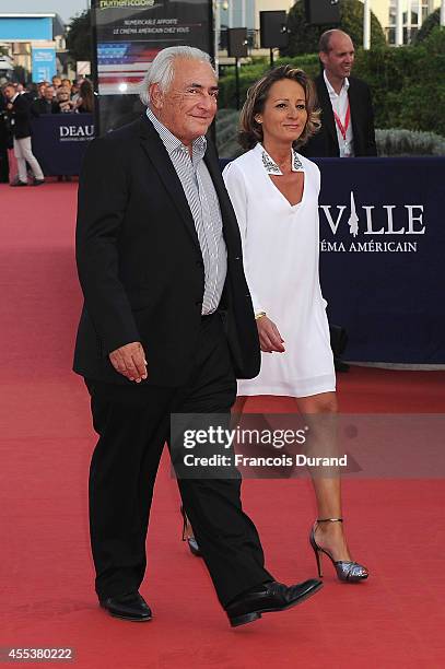 Dominique Strauss-Kahn and Myriam L'Aoufir arrive at the closing ceremony and the 'Sin City : A Dame To Kill For' premiere of during the 40th...