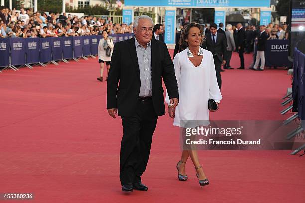 Dominique Strauss-Kahn and Myriam L'Aoufir arrive at the closing ceremony and the 'Sin City : A Dame To Kill For' premiere of during the 40th...