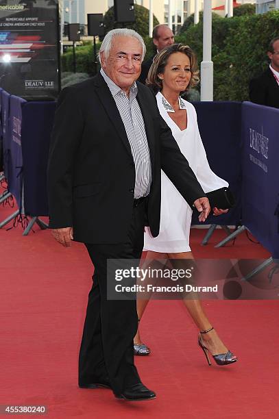 Dominique Strauss-Kahn and Myriam L'Aoufir arrive at the closing ceremony and the 'Sin City : A Dame To Kill For' premiere of during the 40th...