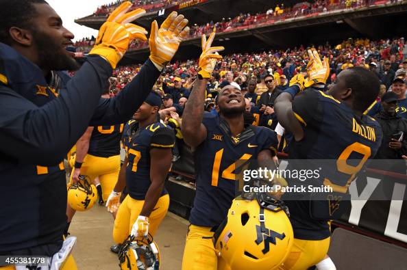 John Ricky Rumph Ricky Rumph, KJ Dillon and the teammates of the West Virginia... Photo ...