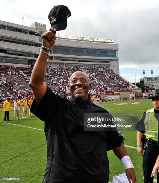 Head coach Ruffin McNeill of the East Carolina Pirates celebrates after the game at Lane Stadium on September 13, 2014 in Blacksburg, Virginia. East...