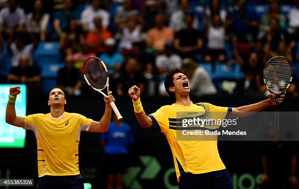 Bruno Soares and Marcelo Melo of Brazil celebrate victory against Marc Lopez and David Marrero of Spain after their play-off doubles match on Day Two...