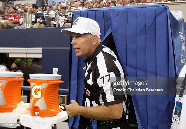 Referee Terry McAulay leaves the instant replay booth during the NFL game between the San Francisco 49ers and the Dallas Cowboys at AT&T Stadium on...