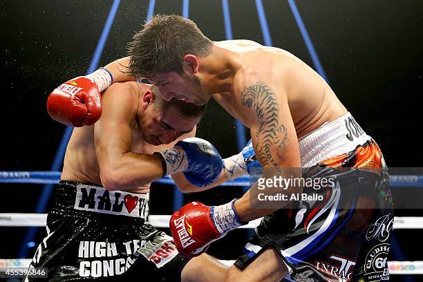 Humberto Soto and John Molina Jr. Exchange blows during their junior welterweight fight at the MGM Grand Garden Arena on September 13, 2014 in Las...