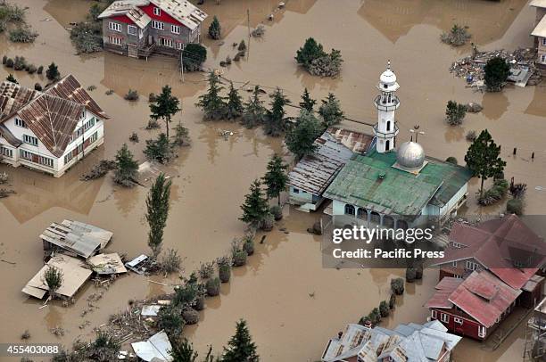 An aerial view of houses submerged in flood waters in Srinagar. The floods and landslides from days of heavy monsoon rains have now claimed more than...