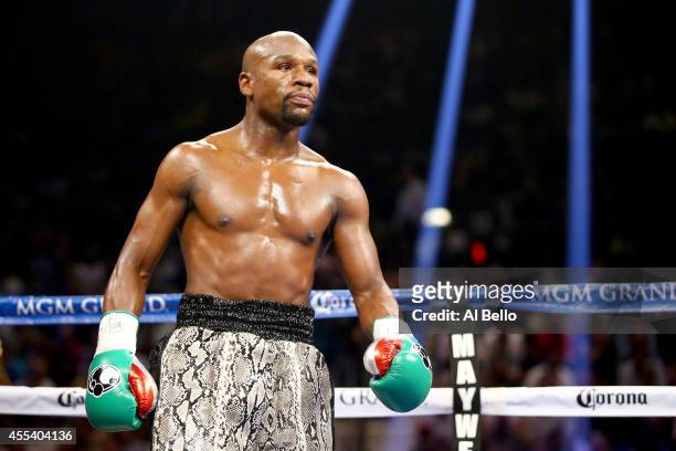Floyd Mayweather Jr. Looks on while taking on Marcos Maidana during their WBC/WBA welterweight title fight at the MGM Grand Garden Arena on September...