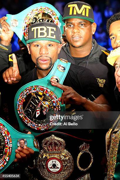 Floyd Mayweather Jr. Celebrates his unanimous-decision victory over Marcos Maidana during their WBC/WBA welterweight title fight at the MGM Grand...