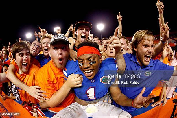 Vernon Hargreaves III of the Florida Gators celebrates after defeating the Kentucky Wildcats in triple overtime at Ben Hill Griffin Stadium on...