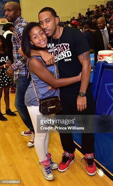 Karma Bridges and Ludacris attend the LUDA vs YMCMB celebrity basketball game at Georgia State University Sports Arena on August 31, 2014 in Atlanta...