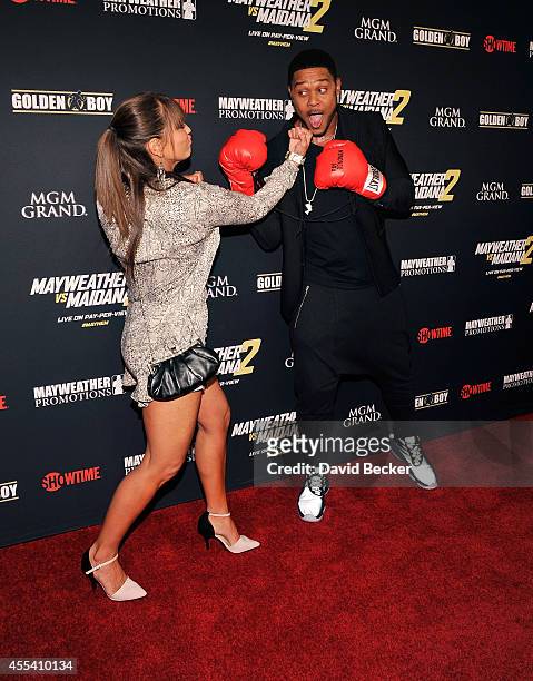 Actor Pooch Hall and his wife, Linda Hall, goof around on the red carpet as they arrive at Showtime's VIP prefight party for "Mayhem: Mayweather vs....