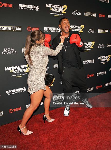 Actor Pooch Hall and his wife, Linda Hall, goof around on the red carpet as they arrive at Showtime's VIP prefight party for "Mayhem: Mayweather vs....