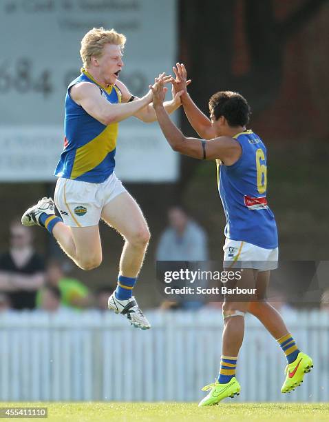 Jack Charleston of Williamstown celebrates with Anton Woods after kicking a goal during the VFL Preliminary Final match between the Box Hill Hawks...