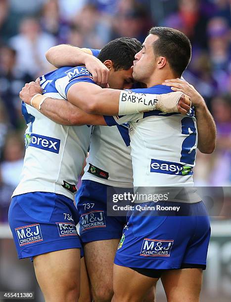 Tim Lafai of the Bulldogs is congratulated by team mates after scoring a try during the NRL 2nd Elimination Final match between the Melbourne Storm...