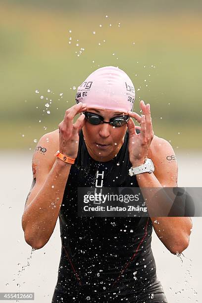 Emma-Kate Lidbury of Great Britain finishes the swimming stage during the 2014 Beijing International Triathlon at Beijing Garden Expo Fengtai...