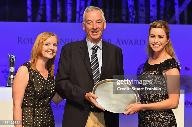 David Cannon of Getty Images recieves The Rolex Lifetime Achievment award from Paula Creamer of USA and Kelly Thesier, LPGA Director of...