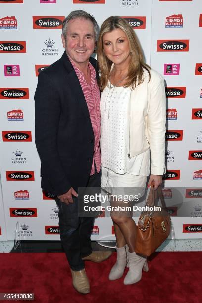 Personality Alan Fletcher and Jennifer Hansen pose on the red carpet prior to the Robbie Williams performance at the Palms at Crown on September 14,...