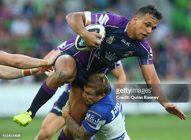 Will Chambers of the Storm is tackled by Mitch Brown of the Bulldogs during the NRL 2nd Elimination Final match between the Melbourne Storm and the...