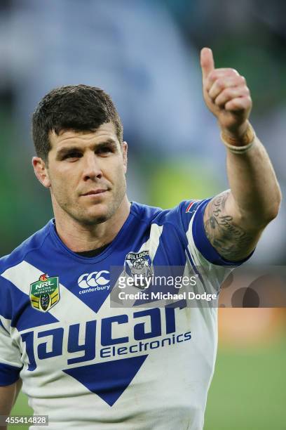 Michael Ennis of the Bulldogs gestures to fans after their win during the NRL 2nd Elimination Final match between the Melbourne Storm and the...
