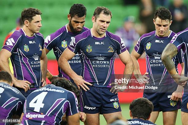Cameron Smith of the Storm speaks to teamates after their defeat during the NRL 2nd Elimination Final match between the Melbourne Storm and the...