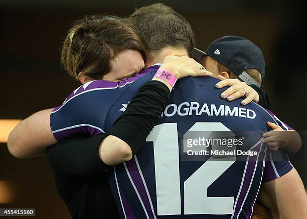 Ryan Hoffman of the Storm is hugged by his wife and his son after playing his last game with the club during the NRL 2nd Elimination Final match...
