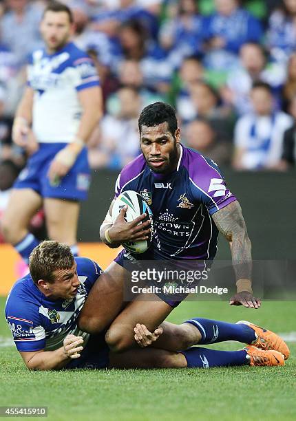 Sisa Waqa of the Storm is tackled during the NRL 2nd Elimination Final match between the Melbourne Storm and the Canterbury Bankstown Bulldogs at...