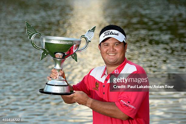 Prom Meesawat of Thailand pictured with the winner's trophy after a 2 hole play-off with Miguel Tabuena of the Philippines during round four of the...