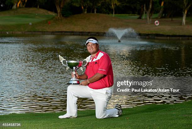 Prom Meesawat of Thailand pictured with the winner's trophy after a 2 hole play-off with Miguel Tabuena of the Philippines during round four of the...