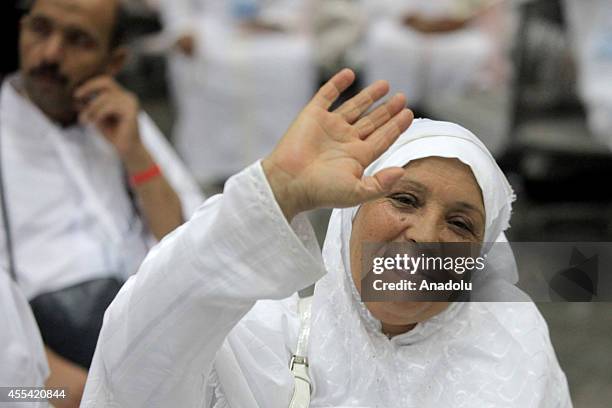 Muslim female prospective pilgrim wave her hand as she waits for the flight to the Muslim Holy Land at International Carthage Airport in Tunis,...