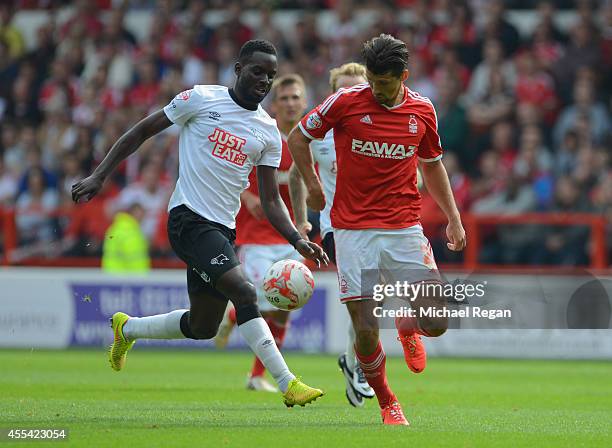 Eric Lichaj of Notts Forest and Simon Dawkins of Derby in action during the Sky Bet Championship match between Nottingham Forest and Derby County at...