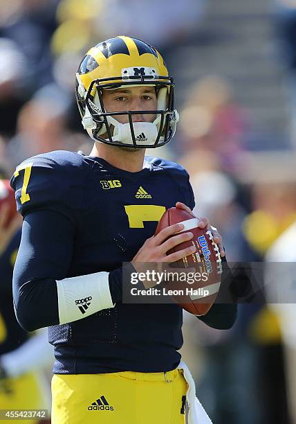 Quarterback Shane Morris of the University of Michigan warms up prior to the start of the game against the Miami University Redhawks at Michigan...