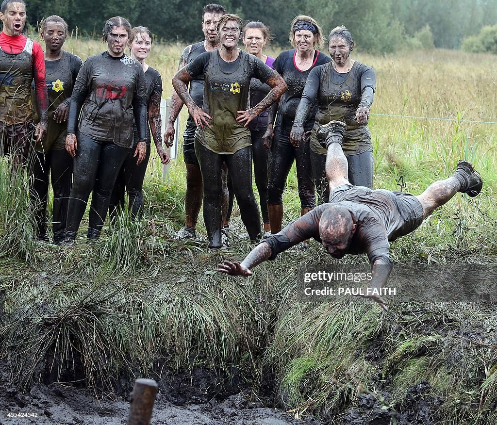 Mudf Rice A competitor competes in the Mud Madness race, at Foymore Lodge in ...
