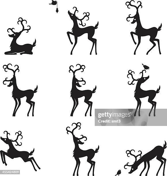 silhouette reindeers - robin flying stock illustrations