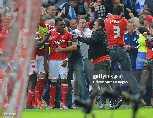 Britt Assombalonga of Forest celebrates scoring to make it 1-0 dwith team mates and fans during the Sky Bet Championship match between Nottingham...