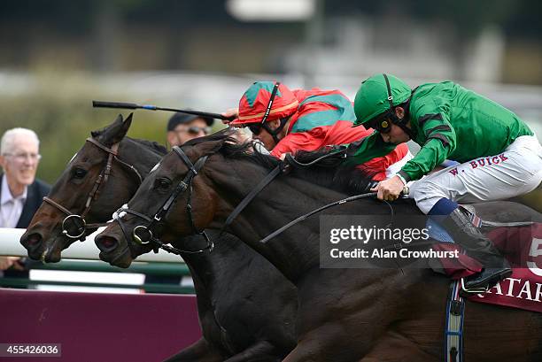 Maxime Guyon riding Baltic Baroness wins The Qatar Prix Vermeille from Willaim Buick riding Pomology at Longchamp racecourse on September 14, 2014 in...