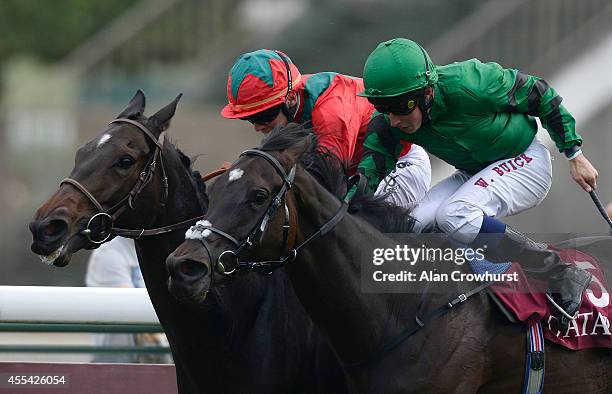 Maxime Guyon riding Baltic Baroness wins The Qatar Prix Vermeille from Willaim Buick riding Pomology at Longchamp racecourse on September 14, 2014 in...