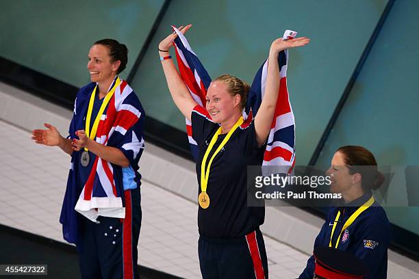Gold medalist Kimberley Sterling of Great Britain celebrates next to silver medalist Sarah Webster of Australia and bronze medalist Patricia Collins...