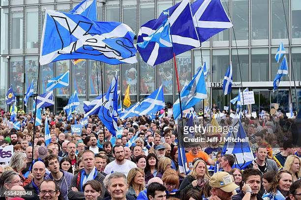 Pro independence supporters march through Glasgow on route to the BBC Scotland where they staged a protest against their perceived bias on September...