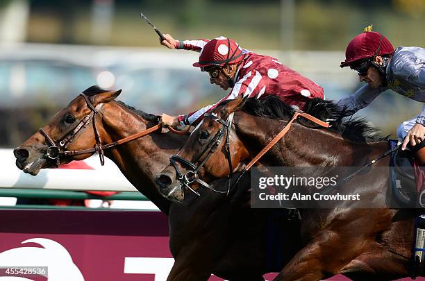 Thierry Jarnet riding Charm Spirit wins The Qatar Prix Du Moulin De Longchamp from Toronado at Longchamp racecourse on September 14, 2014 in Paris,...