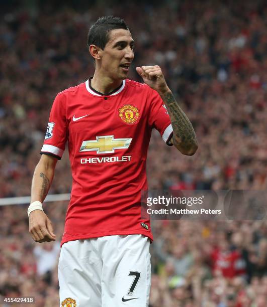 Angel di Maria of Manchester United celebrates scoring their first goal during the Barclays Premier League match between Manchester United and Queens...