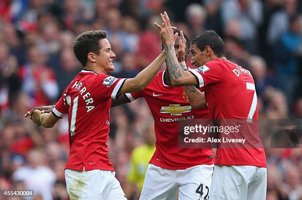 Ander Herrera of Manchester United celebrates scoring the second goal with team-mate Angel Di Maria during the Barclays Premier League match between...