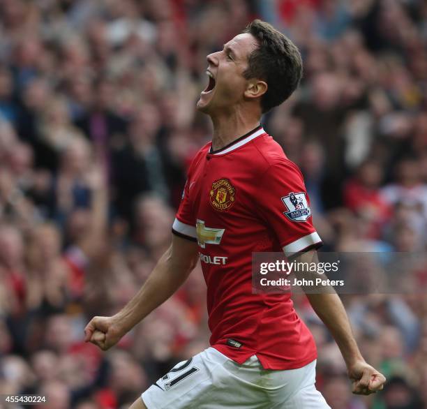 Ander Herrera of Manchester United celebrates scoring their second goal during the Barclays Premier League match between Manchester United and Queens...