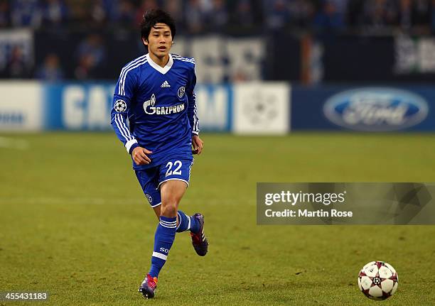 Atsuto Uchida of Schalke 04 runs with the ball during the UEFA Champions League Group E match between FC Schalke 04 and FC Basel 1893 at...