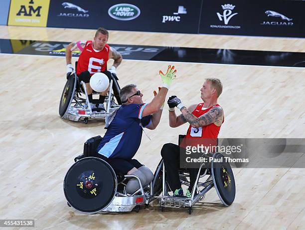 Dennis Ramsay of Australia challenges Alexander Taarnberg of Denmark in the Wheelchair Rugby Bronze medal match during day 2 of the Invictus Games,...