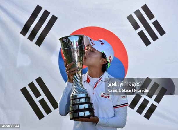 Hyo Joo Kim of South Korea with the trophy for winning The Evian Championship at the Evian Resort Golf Club on September 14, 2014 in Evian-les-Bains,...