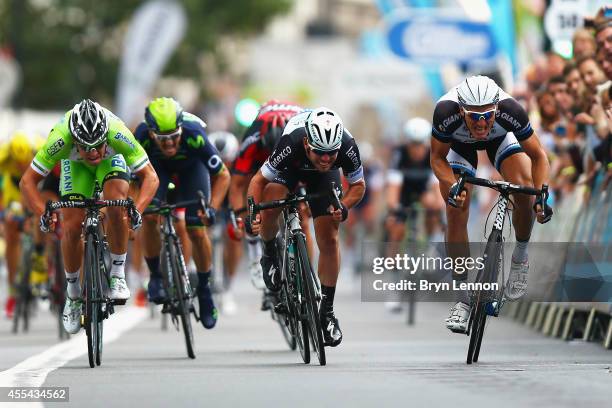 Mark Cavendish of Great Britain and Omega Pharma-QuickStep sprints against Marcel Kittel of Germany and the Giant-Shimano Team during stage 8b of the...