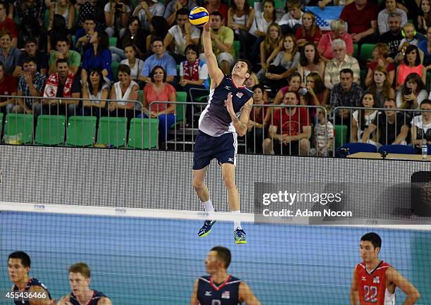 Matthew Anderson of the United Staes serves the ball during the FIVB World Championships match between Argentina and USA on September 14, 2014 in...