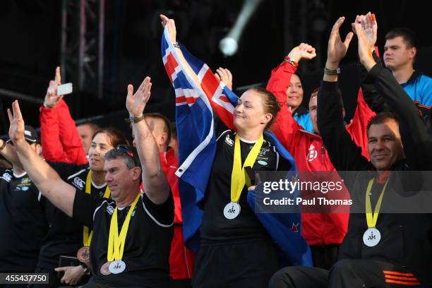 Members of the Netherlands, New Zealand and Denmark teams enjoy the atmosphere on stage during the Closing Ceremony for the Invictus Games, presented...