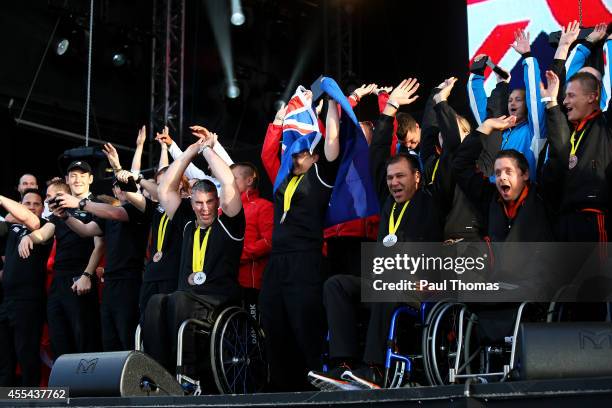 Members of the Netherlands, New Zealand and Denmark teams enjoy the atmosphere on stage during the Closing Ceremony for the Invictus Games, presented...