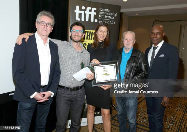 Director and CEO Piers Handling, Executives Noah Segal and Laurie May accept the Grolsch People's Choice Award Winner on behalf of "The Imitation...