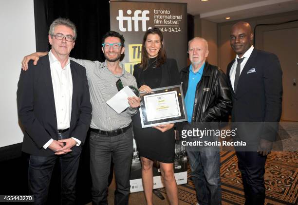 Director and CEO Piers Handling, Executives Noah Segal and Laurie May accept the Grolsch People's Choice Award Winner on behalf of "The Imitation...